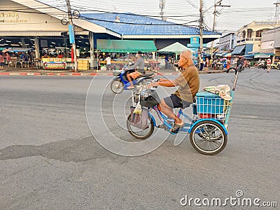 An old man driving his custome blue tricycle on the street of Paknampran, Hua Hin Thailand December 22, 2018 Editorial Stock Photo