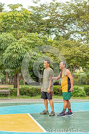 Old man happy with exercise to play basketball at BangYai Park. Editorial Stock Photo