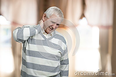 Old man has neck pain. Stock Photo