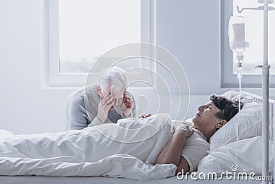 Old man losing faith Stock Photo