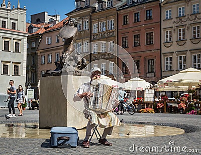 Old man playing accordion in Warsaw. Editorial Stock Photo