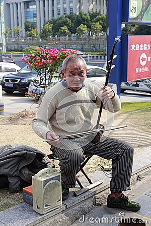 old man playing an erhu Editorial Stock Photo