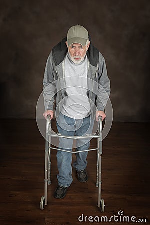 Old Man Resting On His Walker Stock Photo