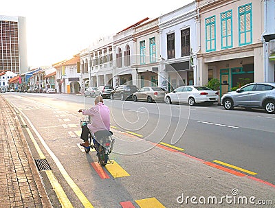 Old Man Riding a Bicycle Alone on The Street Singapore Editorial Stock Photo