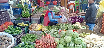 A old Man selling and other young Man purchasing fresh vegetables Editorial Stock Photo