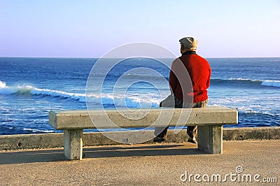 Old Man sitting on the bench Stock Photo