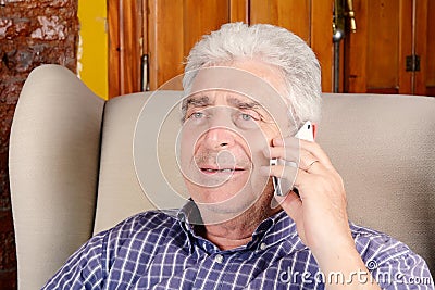 Old man talking on phone. Stock Photo