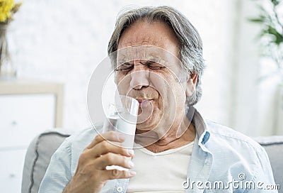 Old man with tooth sensitivity Stock Photo