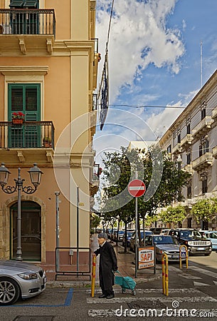 Old man waiting to cross street in Taranto Editorial Stock Photo