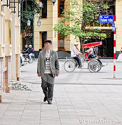 An old man walking on street at Old Town in Hanoi, Vietnam Editorial Stock Photo