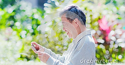 Old man watch video Stock Photo