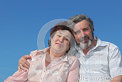 Old man and woman embracing and smiling Stock Photo