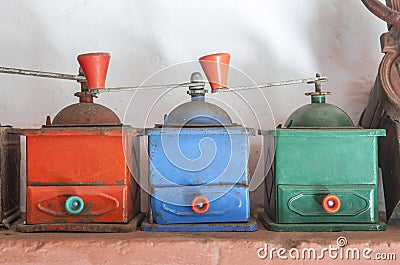 Old manual colorful coffee grinders Stock Photo