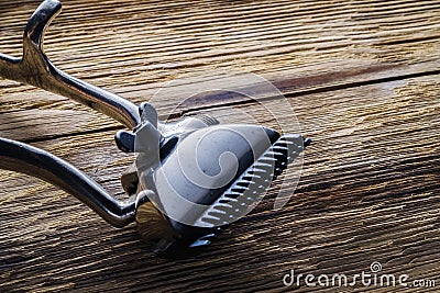 Old manual haircut machine on old wooden scrached background. Stock Photo