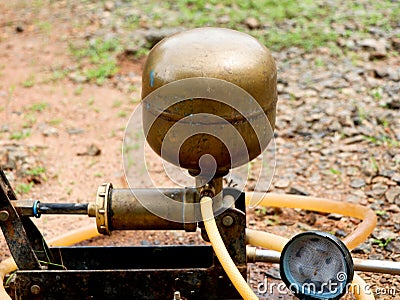 Old manuel spraying pump set made of copper and iron for agriculture, vintage Stock Photo