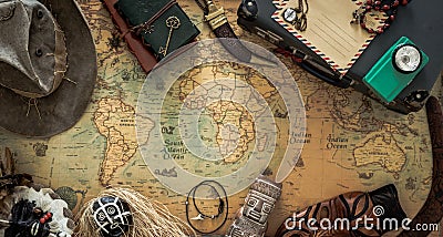 Old map, vintage travel equipment and souvenirs from the travel around the world Stock Photo