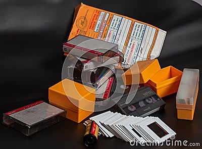 Old Media Stuffs, Old Video Cassette, Old Film reel,Negative Photo reel, Photo Cartridges for Photo projector, Vintage shooting Editorial Stock Photo