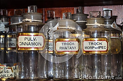 Medicine Bottles on Shelf in Museum Editorial Stock Photo