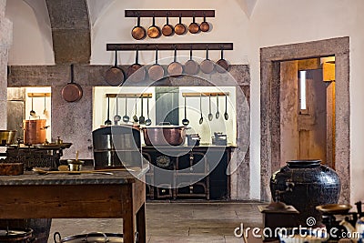 Old medieval castle kitchen with equipment Stock Photo