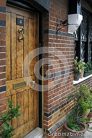 Old medieval English castle in UK. Wooden doors Stock Photo