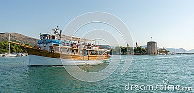 Old medieval fortress of Trogir Kamerlengo Castle on Dalmatian Island with boat, Split city region. Editorial Stock Photo
