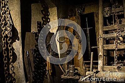 Old medieval torture chamber with many pain tools Stock Photo