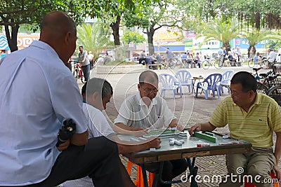 Old men playing mahjong Editorial Stock Photo