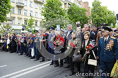 An old men and women, participants of World War 2, marching on the street Editorial Stock Photo