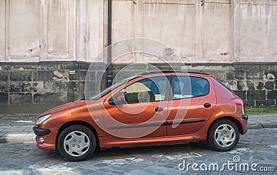 Old metal brown small cheap compact car Peugeot 207 Editorial Stock Photo