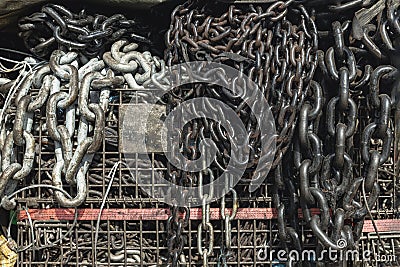 Old metal chain links stocked in store. Chains for heavy industrial use, Iron chain texture background Stock Photo