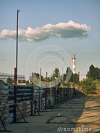 An old metal fence, the metal surface has rusted, the paint has burned out Stock Photo