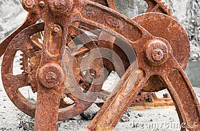 Old metal rusty mechanism with frame, wheels and gears Stock Photo