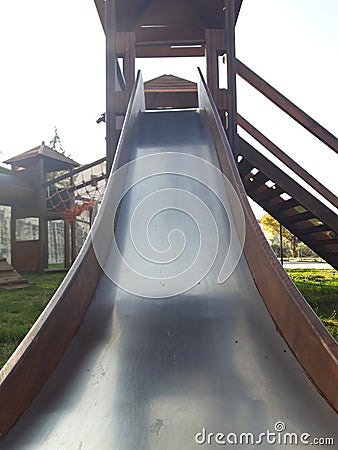 old metal slide on a children& x27;s playground in a country Stock Photo