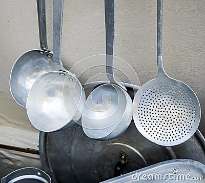 Old metal utensils for cooking on a local market Stock Photo