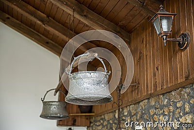 Old metal water buckets - traditional Bulgarian copper water container. Stock Photo