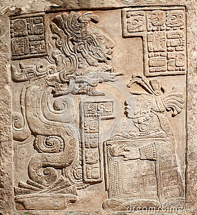 Old mexican relief carved in stone Stock Photo