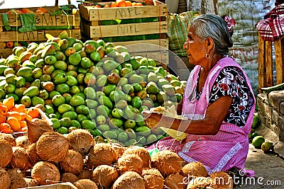 Old mexican woman selling fruits at market Editorial Stock Photo