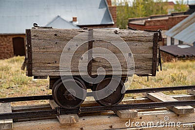 Old mining ore cart on tracks at the abandoned ghost town of South Park City Colorado, near Fairplay Stock Photo