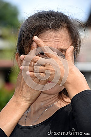 An Old Minority Granny Afraid Stock Photo