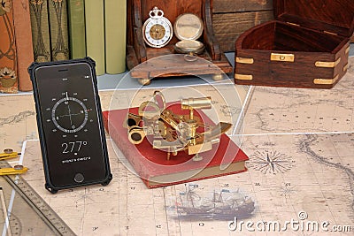 Old and modern navigation, nautical chart, sextant and mobile ph Stock Photo