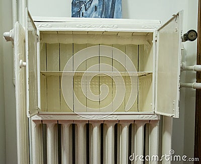 Metal cabinet on the radiator. Stock Photo