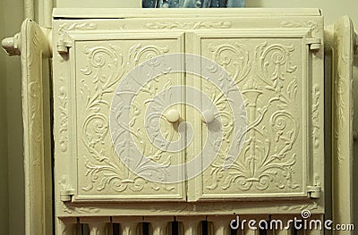 Metal cabinet on the radiator. Stock Photo