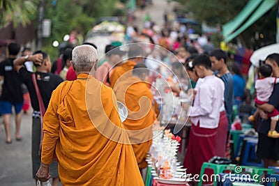 Old Mon monk alms in Mon village, Sangkhla Buri Editorial Stock Photo