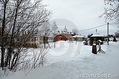 Staraya Ladoga, Russia, January 5, 2019. View of the dilapidated buildings and the restored temple of the female Orthodox monaster Editorial Stock Photo