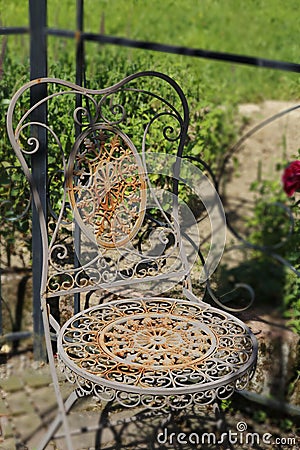 Old more rusty, more romantically, chair from metal, Stock Photo