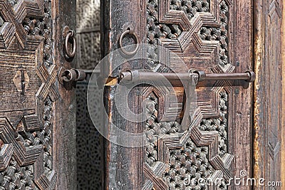 Old Moroccan, wooden door detail. Koranic school, Madrasa Bou Inania, Fes, Morocco Stock Photo