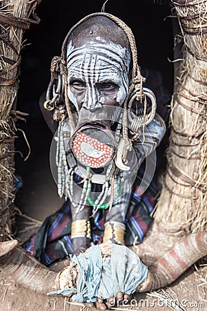 Old Mursi woman in her hut Editorial Stock Photo