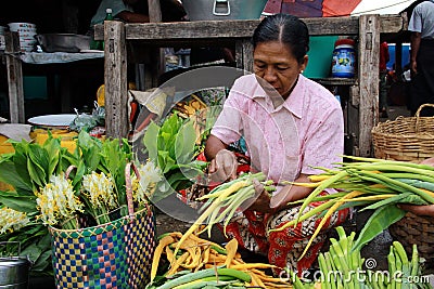 Old Myanmar woman selling vegetables Editorial Stock Photo