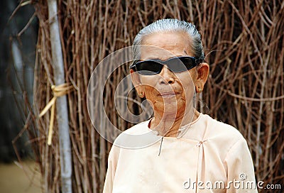 Old Myanmar woman wearing shades Editorial Stock Photo