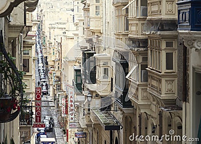 Old Narrow Street With Traditional Closed Wooden Balconies In Valletta Editorial Stock Photo